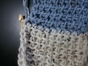 Continue working like this, in TSS on a 10 stitch square. Do not forget to pick up an extra loop in the side edge of the original square. This connects the two squares together. Work 10 rows as established and then BO.